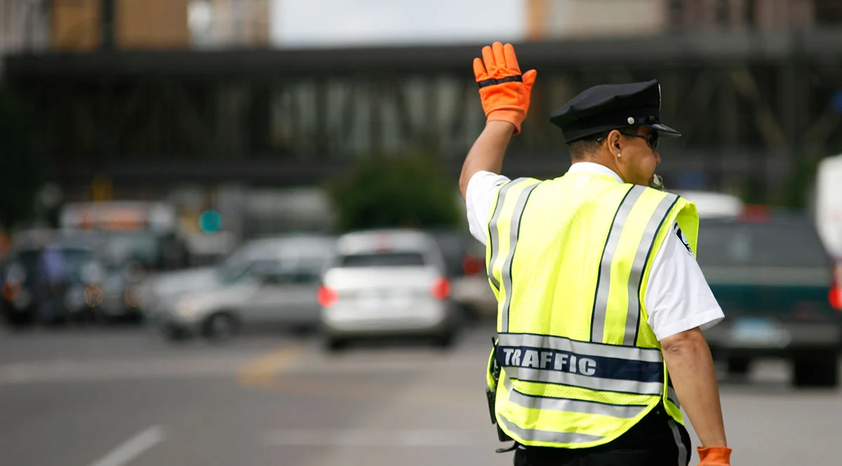 Traffic Control Security Guard Directing Vehicles
